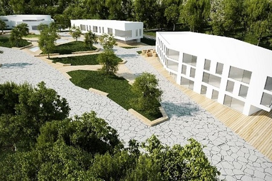 Ein Hof mit grünen Bauminseln. Dahinter befinden sich simulierte Häuser für den InnovationCampus.